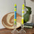 Handpainted colorful candles from South Africa.  Taper candles on table with Africa basket.
