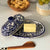 Authentic Mexican Pottery butter dish in blue and white flower design with hand-carved wood serving piece from Kenya.